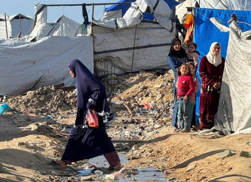 Displaced Palestinians live in makeshift tents along Gaza's beaches amid flooding and harsh winter conditions.