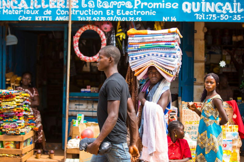 A trader walks through a market in the Central African Republic.